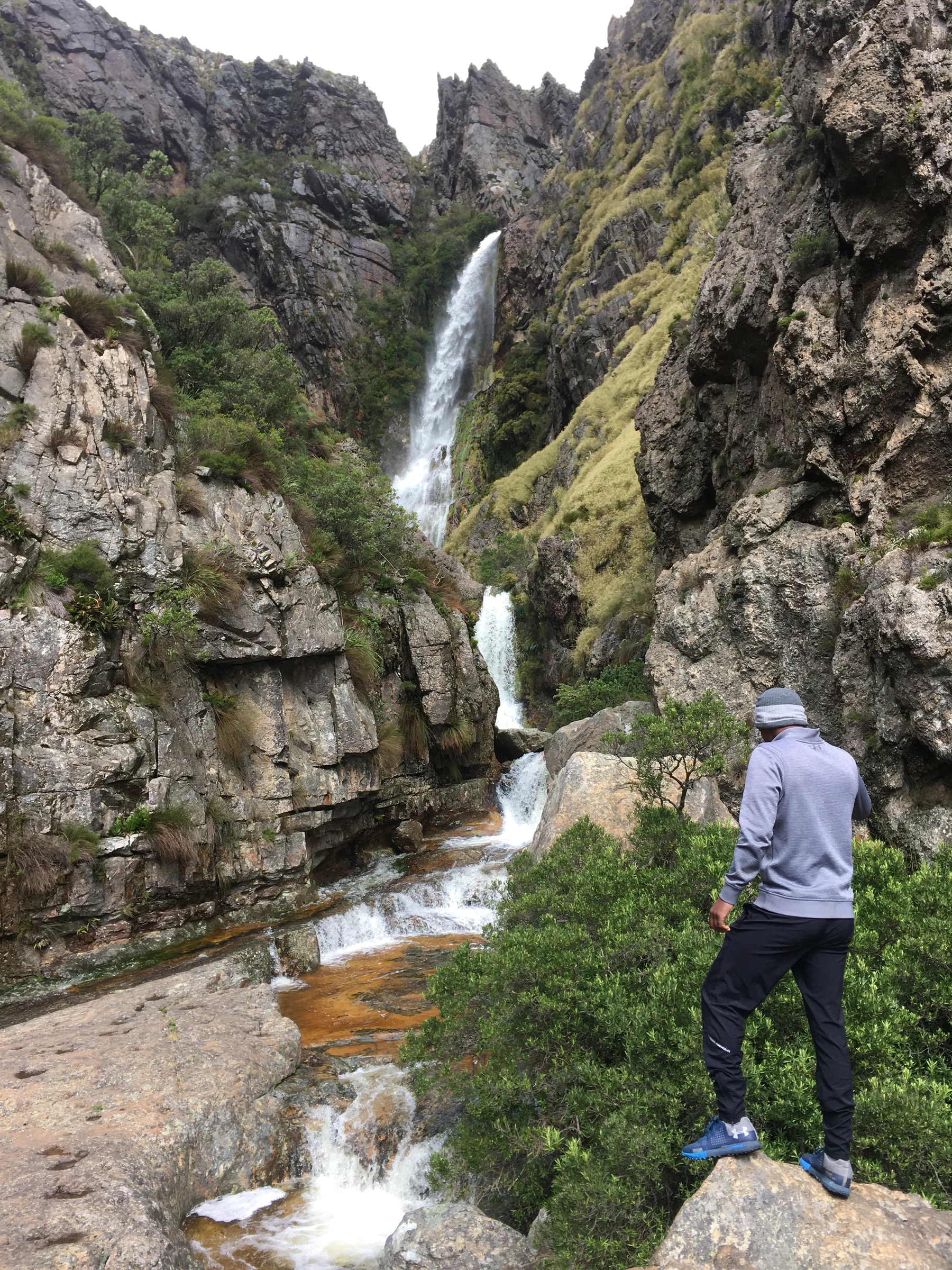 Hiker looking toward the Bobbejaansrivier waterfall