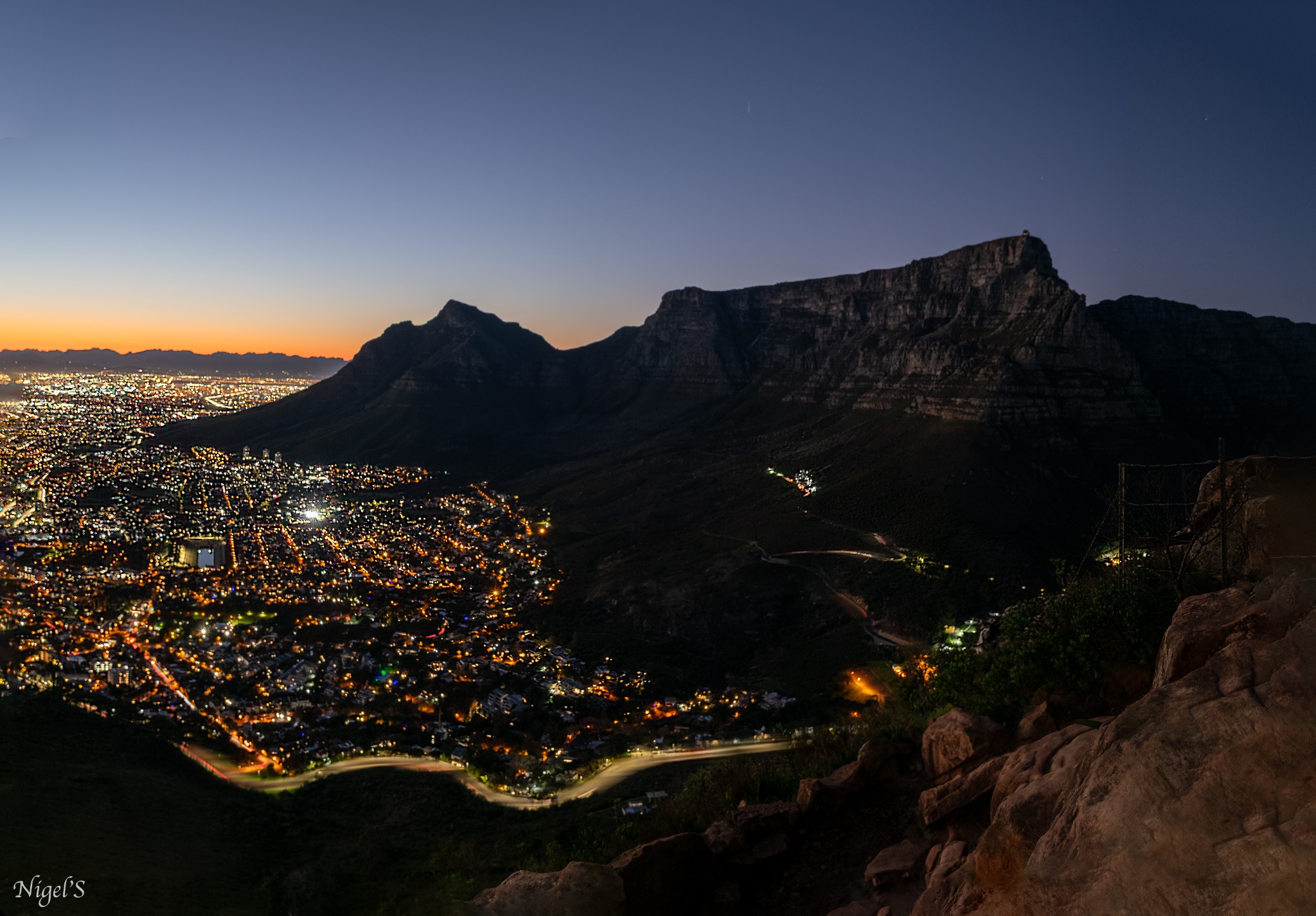 Cape Town city lights and Table Mountain seen during an early Lion's Head hike