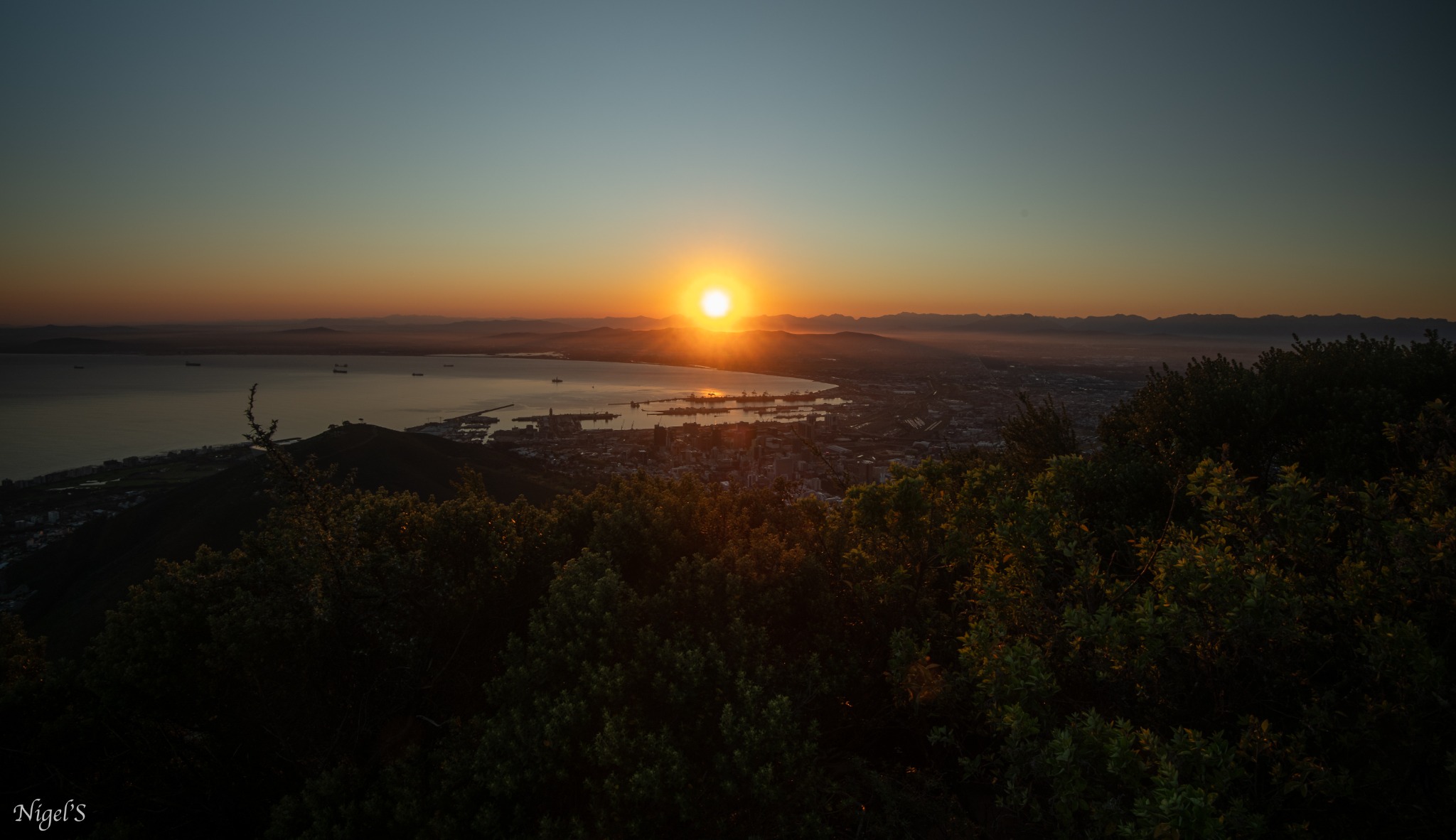 Sun rising over Cape Town viewed from Lion's Head