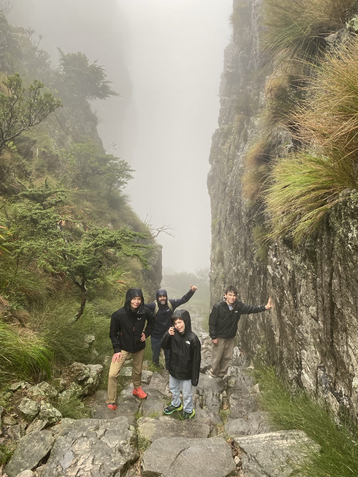 Hiking group in mist and wet conditions on Table Mountain